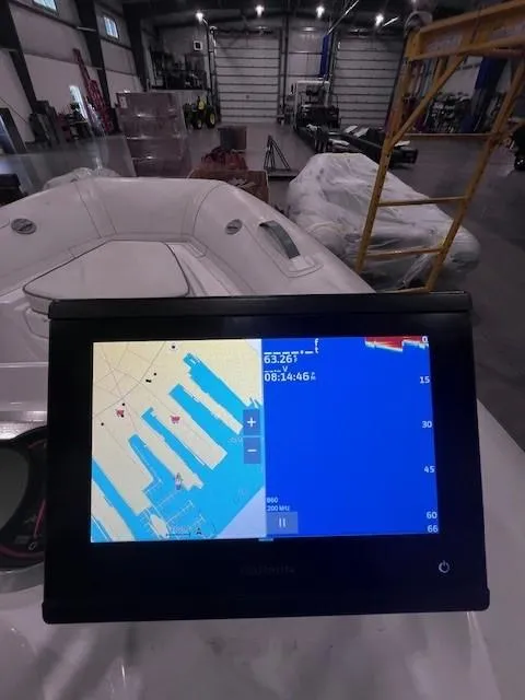 Slide: The Image of 2023 AB Inflatables ABJET 350XP with navigation display in a warehouse setting. - 7