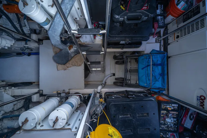 Slide: The Image of Engine room of 2006 Sea Ray 58 Sedan Bridge with equipment and storage. - 19