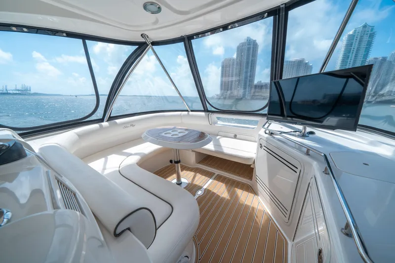 Slide: The Image of Luxurious interior of 2006 Sea Ray 58 Sedan Bridge yacht with city skyline view. - 38