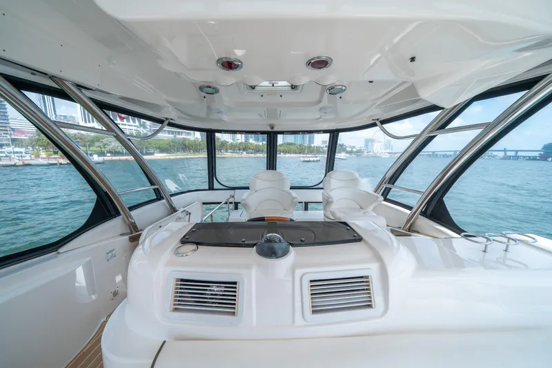 Slide: The Image of Interior view of 2006 Sea Ray 58 Sedan Bridge yacht with panoramic windows. - 39