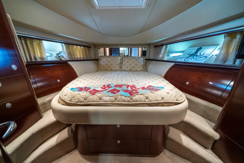Slide: The Image of Luxurious 2006 Sea Ray 58 Sedan Bridge yacht bedroom with elegant bedding and wood accents. - 43