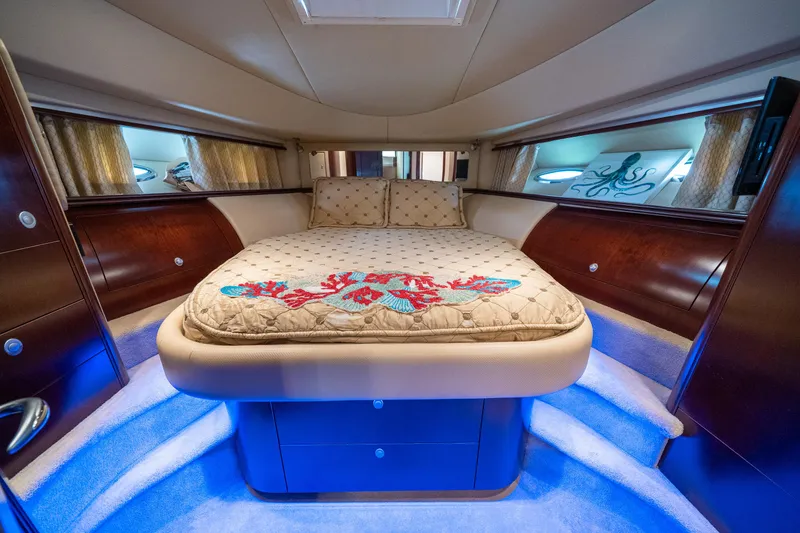 Slide: The Image of Luxurious 2006 Sea Ray 58 Sedan Bridge cabin with elegant bedding and ambient lighting. - 44