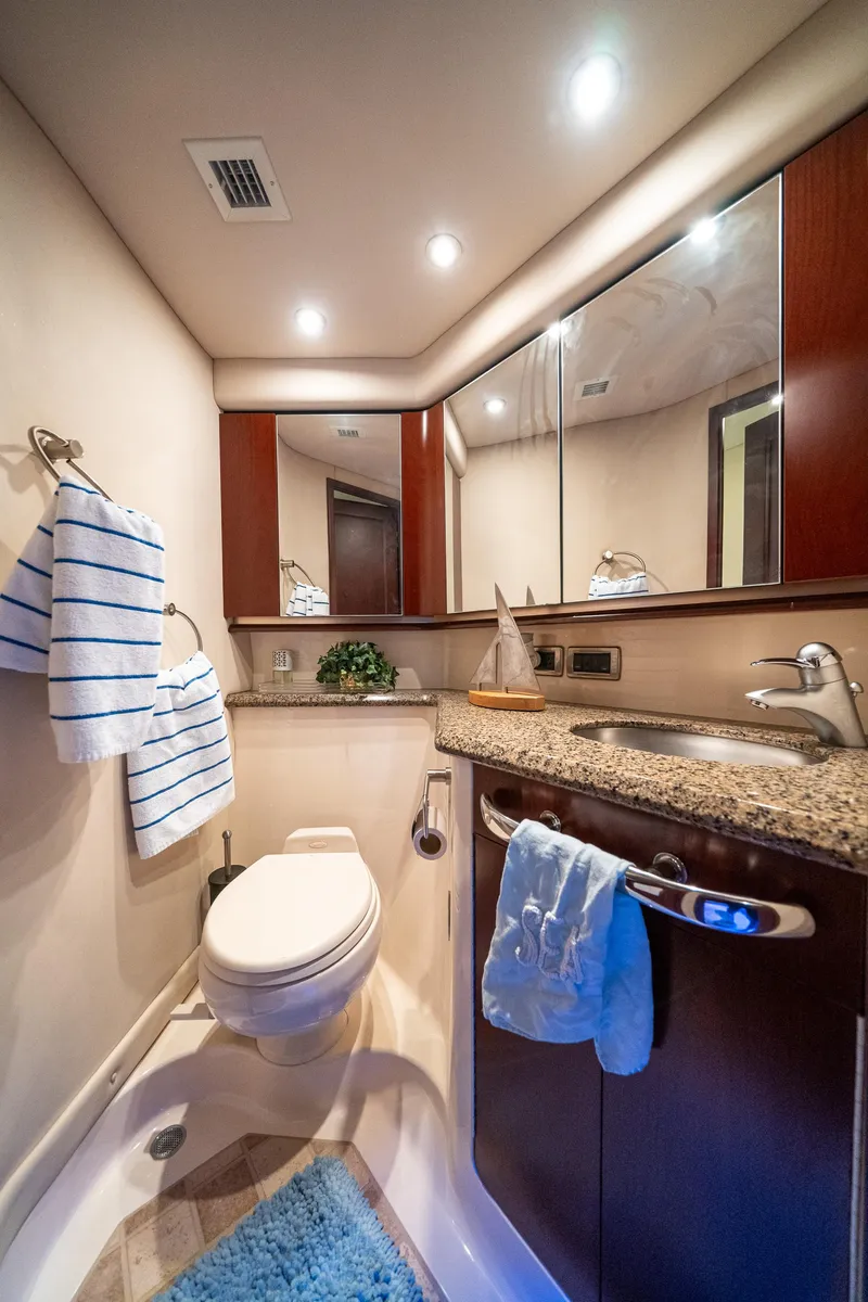 Slide: The Image of Luxurious bathroom in 2006 Sea Ray 58 Sedan Bridge yacht with modern fixtures. - 48