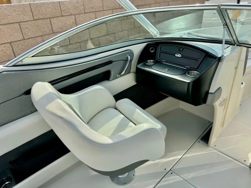 Slide: The Image of 2008 Sea Ray 230 Select Fission boat interior with helm and captain's chair. - 10