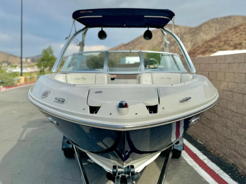 Slide: The Image of 2008 Sea Ray 230 Select Fission boat, parked on a road, front view. - 2