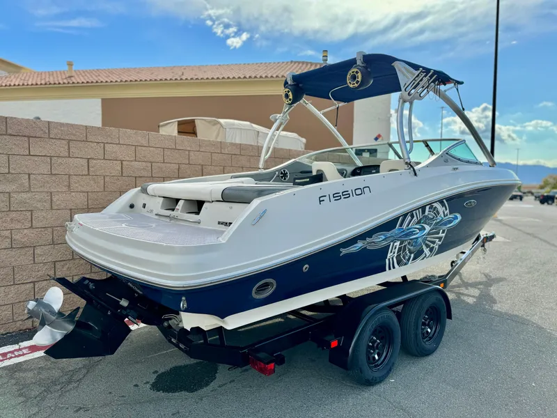 Slide: The Image of 2008 Sea Ray 230 Select Fission boat on trailer, featuring sleek design and graphics. - 5