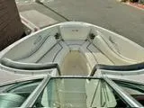 Slide: The Image of 2008 Sea Ray 230 Select Fission boat interior with white seating and open bow design. - 9