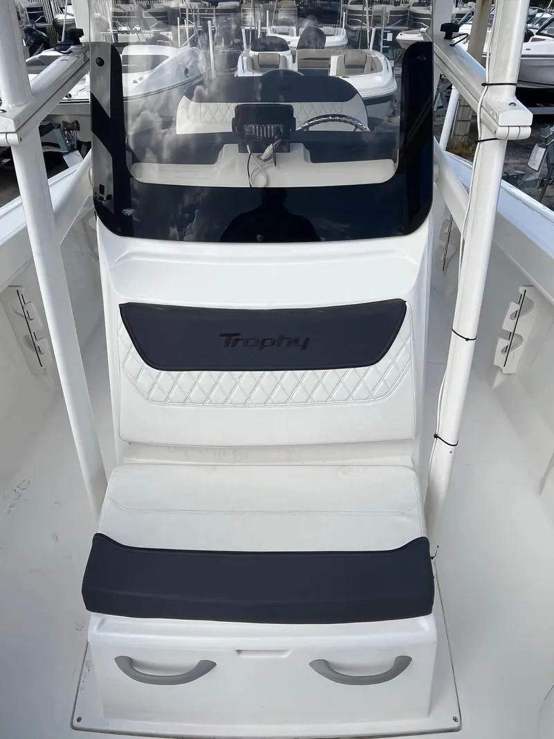Slide: The Image of 2022 Bayliner Trophy T22CC boat interior with seating and console. - 3
