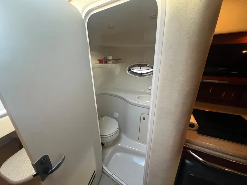 Slide: The Image of 2007 Sea Ray 290 Amberjack bathroom interior with toilet and sink. - 19