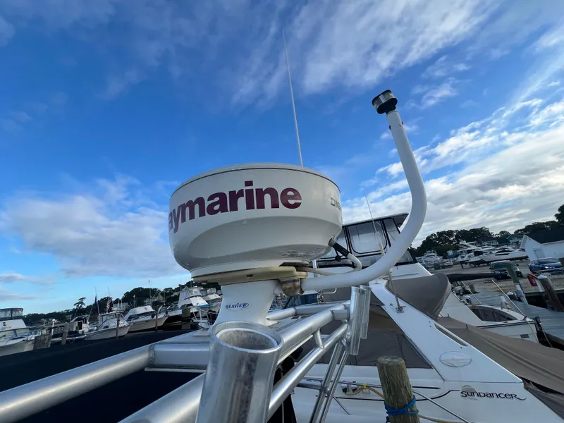 Slide: The Image of Radar equipment on a 2007 Sea Ray 290 Amberjack boat at a marina. - 25