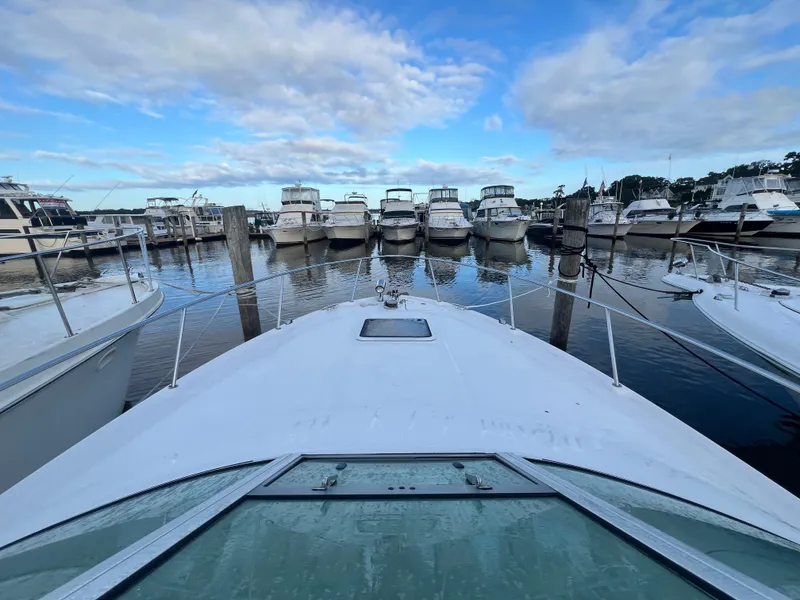 Slide: The Image of 2007 Sea Ray 290 Amberjack docked in a marina with multiple boats. - 26