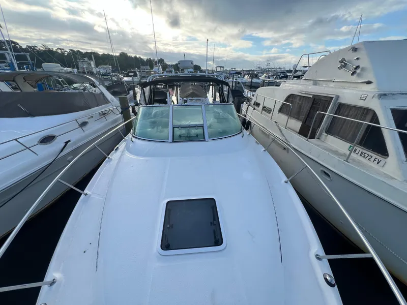 Slide: The Image of 2007 Sea Ray 290 Amberjack docked among other boats at a marina. - 29