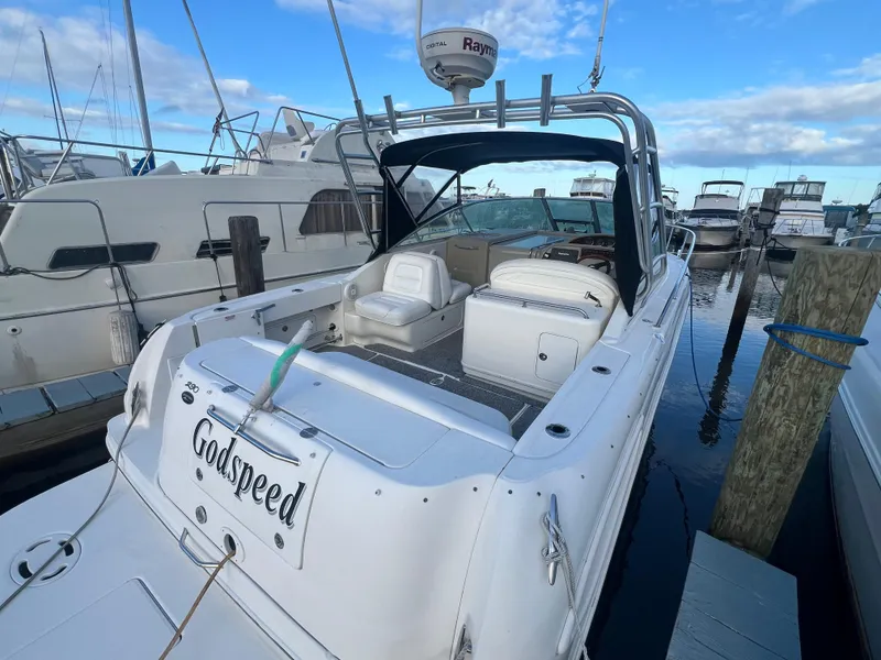 Slide: The Image of 2007 Sea Ray 290 Amberjack boat docked at marina, featuring spacious seating and radar equipment. - 3