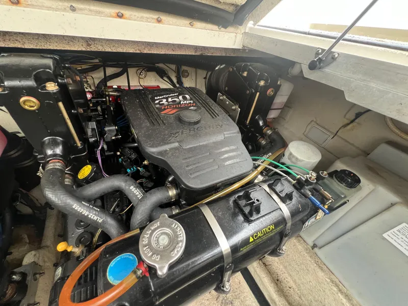 Slide: The Image of Engine compartment of a 2007 Sea Ray 290 Amberjack boat, featuring a MerCruiser 350 MPI engine. - 32