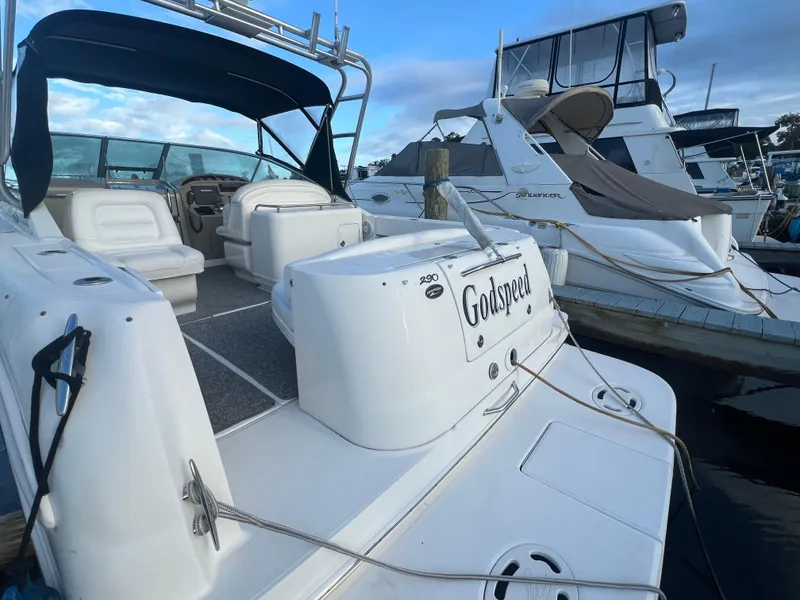 Slide: The Image of 2007 Sea Ray 290 Amberjack boat docked, featuring spacious seating and sleek design. - 5