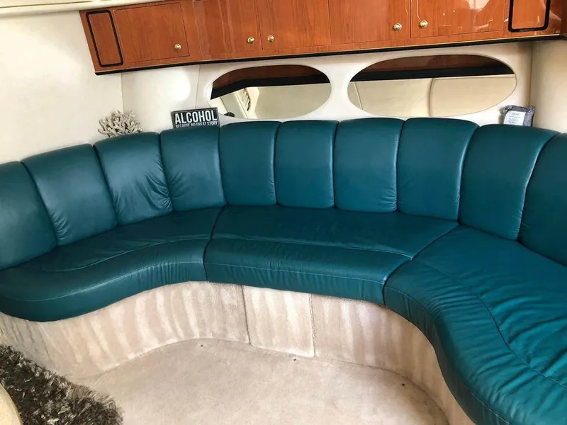 Slide: The Image of Luxurious teal seating in 1997 Sea Ray 400 Sundancer yacht interior. - 13