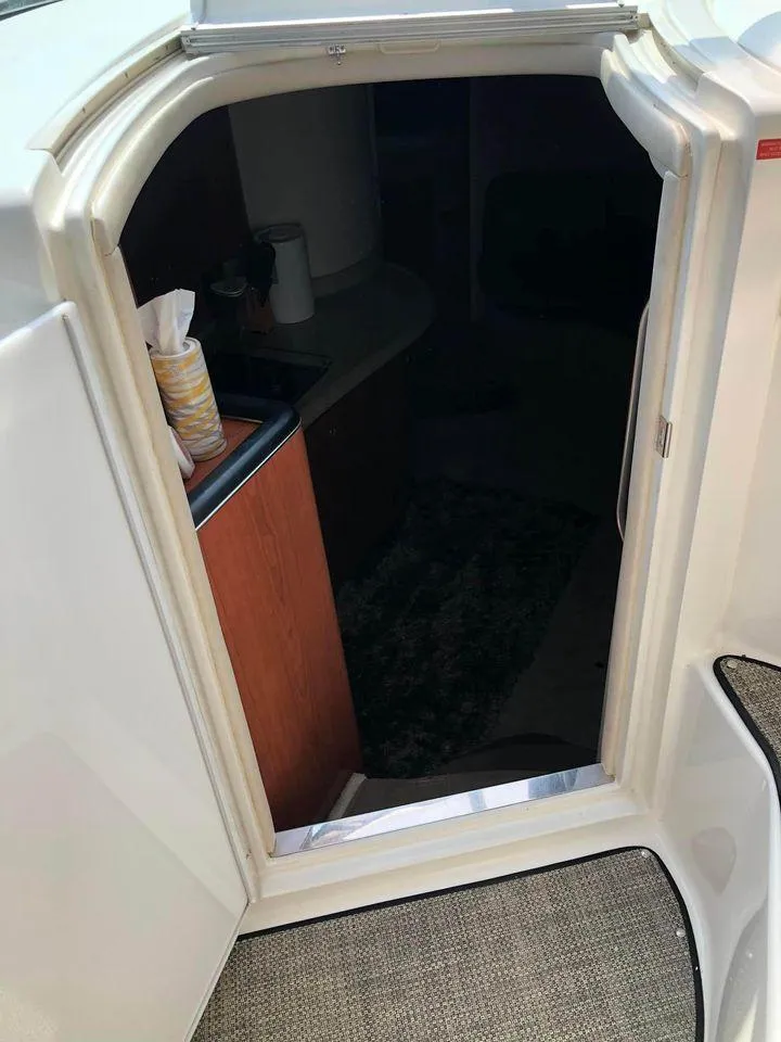 Slide: The Image of 1997 Sea Ray 400 Sundancer cabin entrance with carpeted steps and interior view. - 5