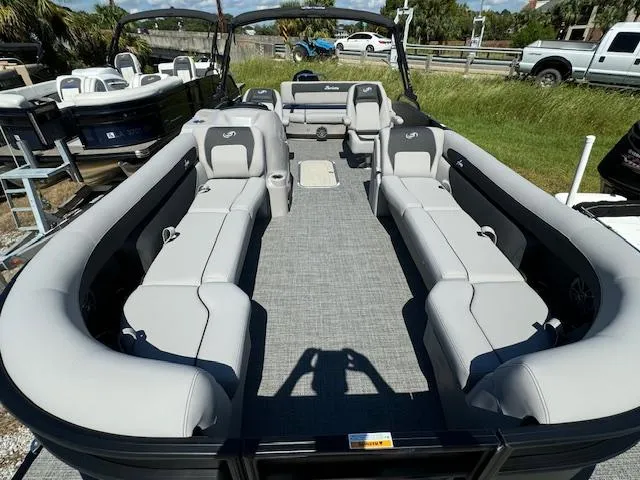 Slide: The Image of 2025 Barletta Aria 24UC pontoon boat with spacious seating and modern design. - 12