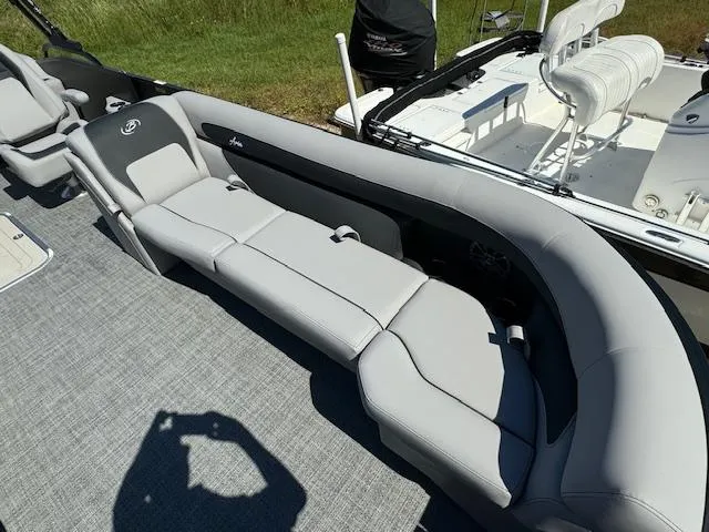 Slide: The Image of 2025 Barletta Aria 24UC pontoon boat with sleek gray seating and modern design. - 13