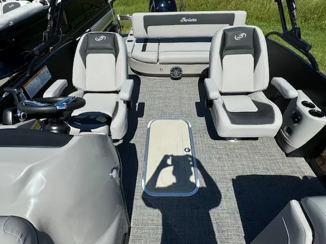 Slide: The Image of 2025 Barletta Aria 24UC pontoon boat interior with plush seating and modern design. - 15