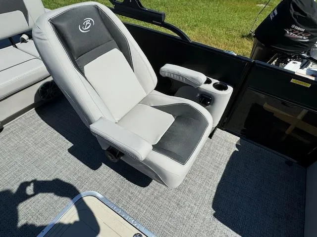 Slide: The Image of Barletta Aria 24UC 2025 boat seat with armrests and cup holders on deck. - 16