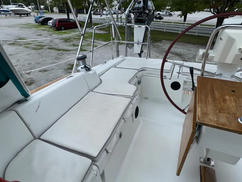 Slide: The Image of 2008 Beneteau Oceanis 37 sailboat cockpit with seating and steering wheel. - 15