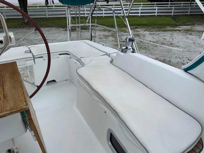 Slide: The Image of 2008 Beneteau Oceanis 37 cockpit with white seating and wooden accents. - 17