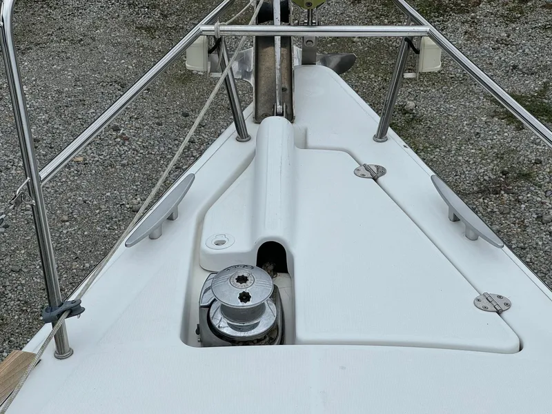 Slide: The Image of Bow of 2008 Beneteau Oceanis 37 sailboat with anchor winch and railings. - 31