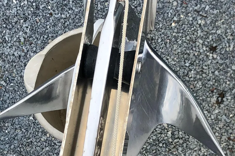 Slide: The Image of Close-up of a 2008 Beneteau Oceanis 37 anchor on gravel surface. - 34