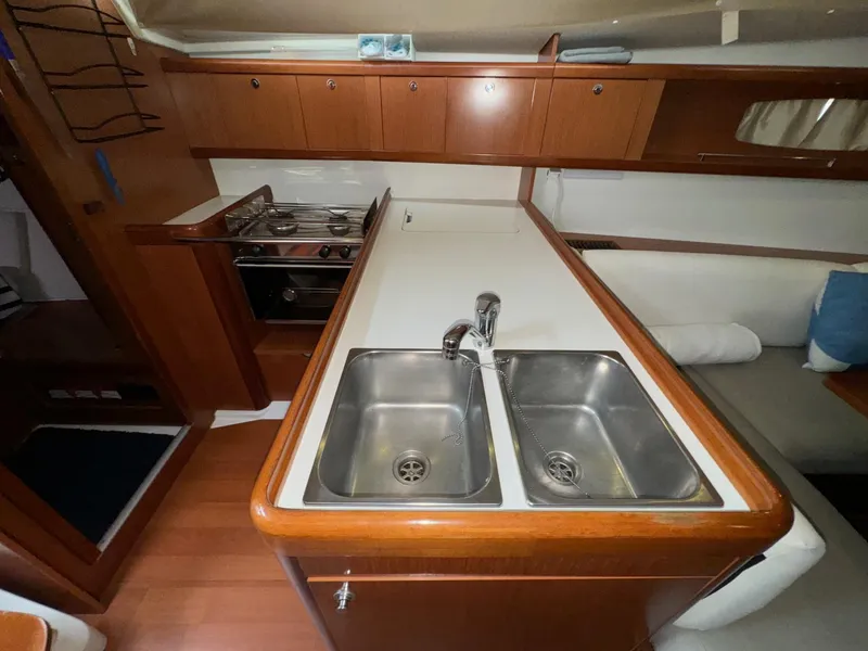 Slide: The Image of Interior of 2008 Beneteau Oceanis 37 yacht kitchen with dual sinks and stove. - 36