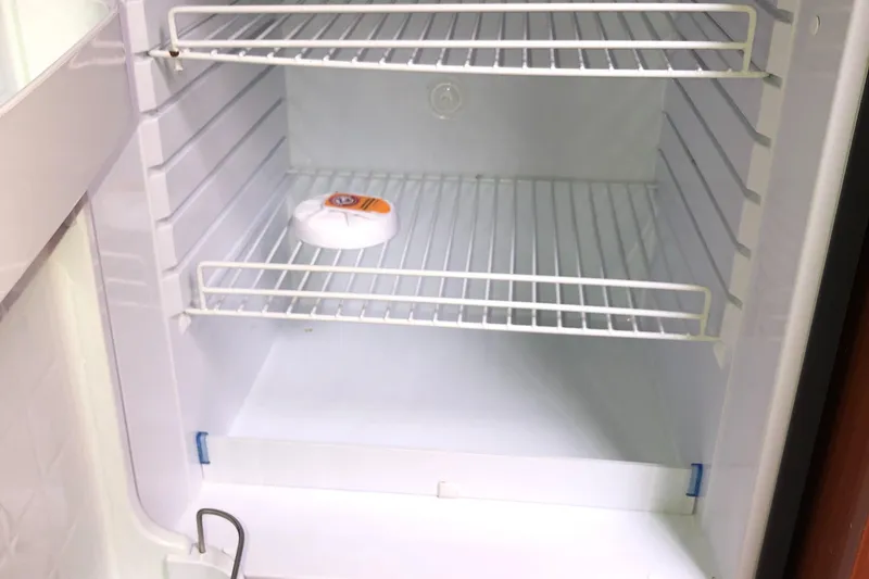 Slide: The Image of Empty refrigerator interior on a 2008 Beneteau Oceanis 37 yacht. - 39