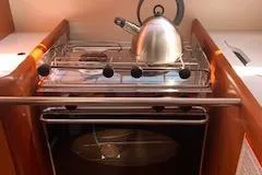 Slide: The Image of Galley stove with kettle on 2008 Beneteau Oceanis 37 sailboat. - 41