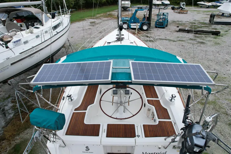 Slide: The Image of Beneteau Oceanis 37 sailboat with solar panels, 2008 model, docked in a boatyard. - 5