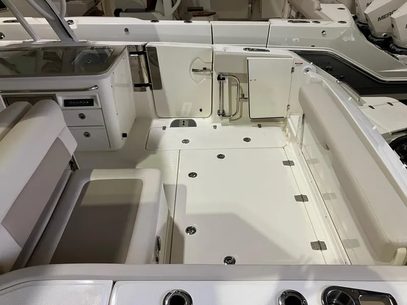 Slide: The Image of 2024 Boston Whaler 320 Vantage boat interior, featuring spacious seating and modern amenities. - 4