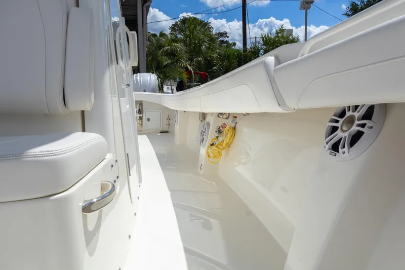 Slide: The Image of 2023 Regulator 34 boat interior with white seating and speakers. - 29