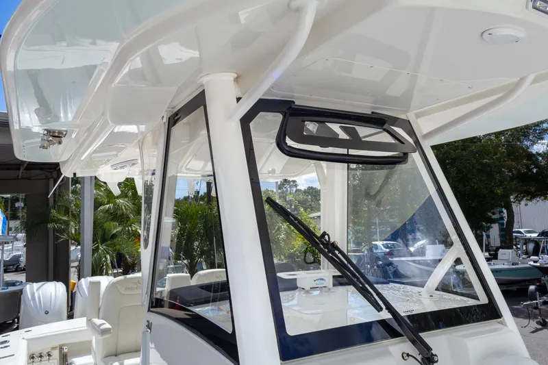 Slide: The Image of 2023 Regulator 34 boat cockpit with windshield and seating, showcasing modern design. - 31
