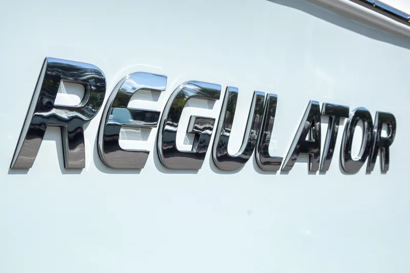 Slide: The Image of Chrome "Regulator" logo on 2023 Regulator 34 boat. - 36