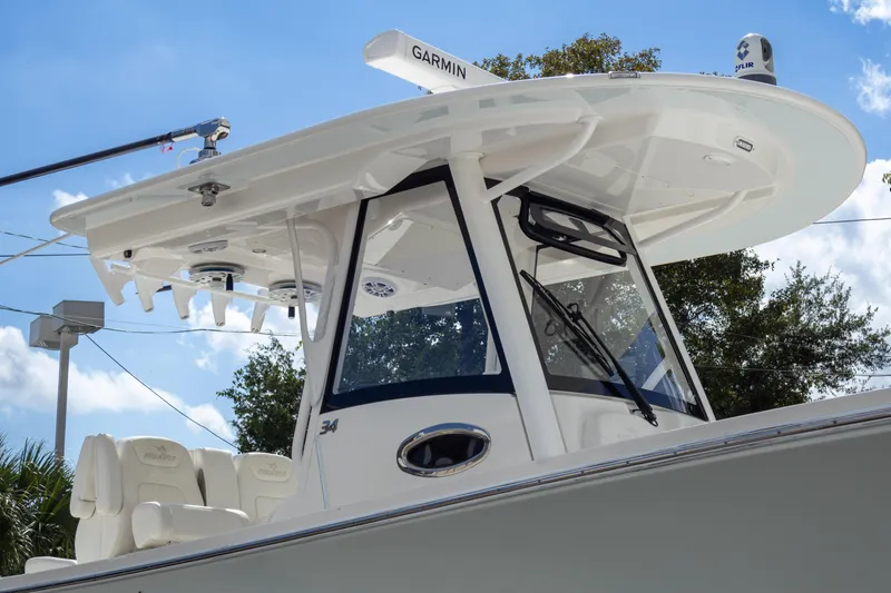 Slide: The Image of 2023 Regulator 34 boat with Garmin equipment, featuring sleek design and modern technology. - 8