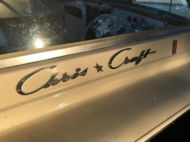 Slide: The Image of 1970 Chris-Craft 25 Lancer boat with classic logo and vintage dashboard. - 12