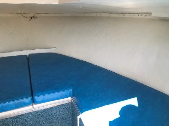 Slide: The Image of Interior cabin of 1970 Chris-Craft 25 Lancer with blue seating and carpet. - 14