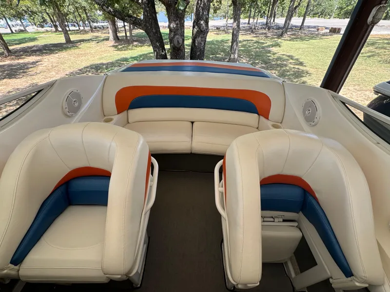 Slide: The Image of Interior of 1997 Campion Chase 910 ZRI boat with white, blue, and orange seating. - 13