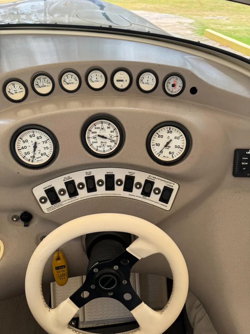 Slide: The Image of Dashboard of a 1997 Campion Chase 910 ZRI boat with gauges and controls. - 15