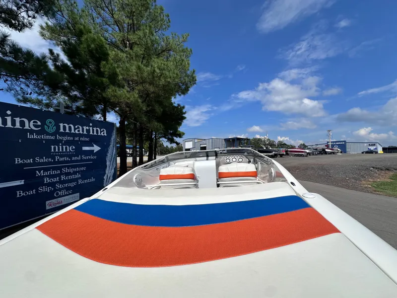 Slide: The Image of 1997 Campion Chase 910 ZRI boat at marina with clear blue sky. - 4