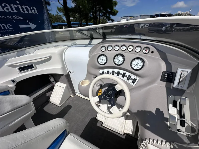 Slide: The Image of 1997 Campion Chase 910 ZRI boat dashboard with steering wheel and gauges. - 5
