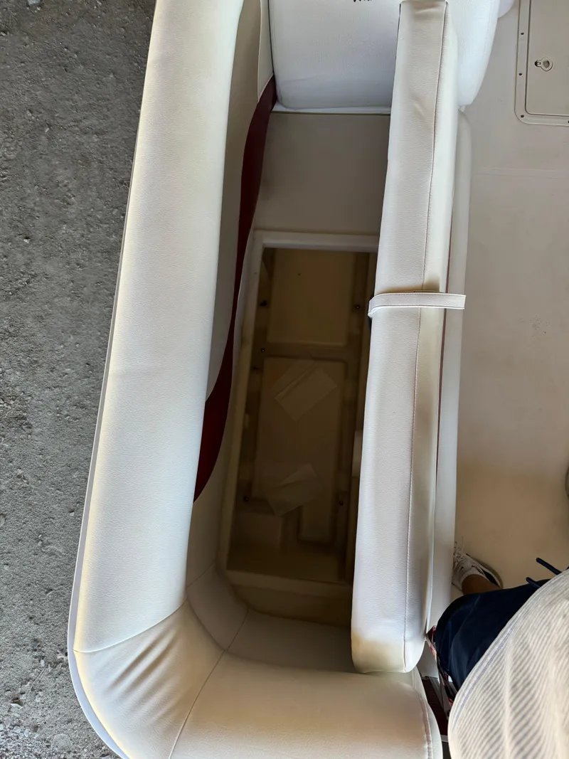 Slide: The Image of 2015 Hurricane Fun Deck 196 boat interior with open storage compartment. - 11