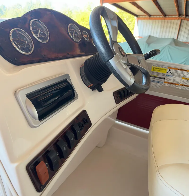 Slide: The Image of 2015 Hurricane Fun Deck 196 boat dashboard with steering wheel and gauges. - 5