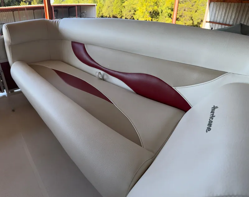 Slide: The Image of 2015 Hurricane Fun Deck 196 boat interior with beige and red seating. - 8