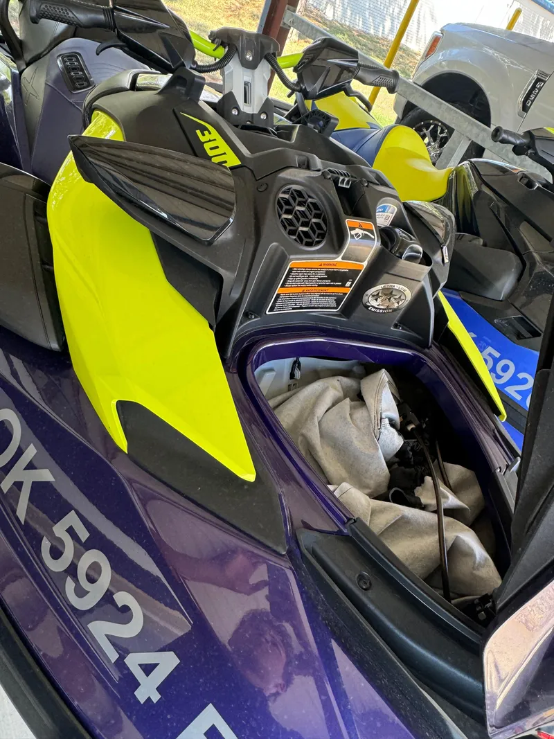 Slide: The Image of 2021 Sea-Doo Wake Pro 230 jet ski, vibrant yellow and black design, parked outdoors. - 5