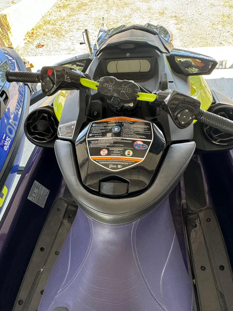 Slide: The Image of 2021 Sea-Doo Wake Pro 230 jet ski cockpit with handlebars and seat. - 8