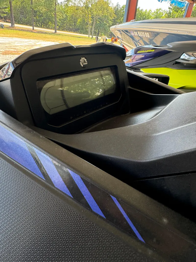 Slide: The Image of 2021 Sea-Doo Wake Pro 230 dashboard close-up with vibrant blue accents. - 9